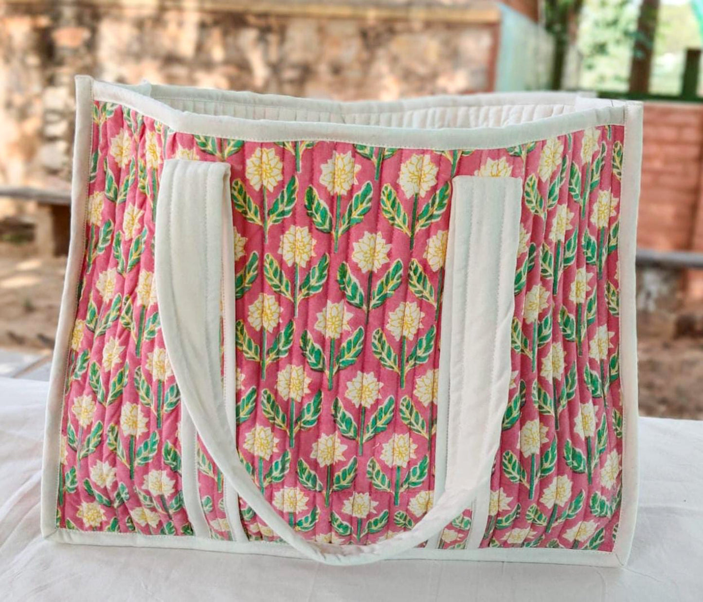 Large quilted weekend tote bag, vibrant pink block print, floral design  
